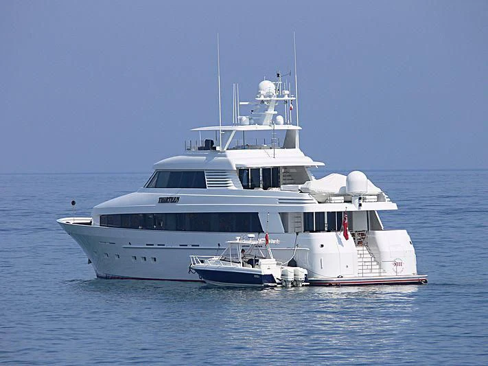 a couple of large white boats in the water aboard SIDRA Yacht for Sale