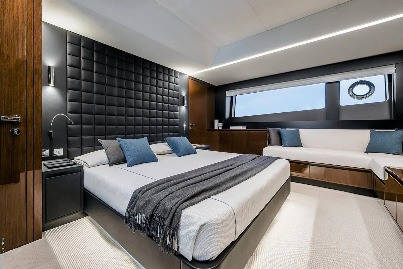 a room with a bed and a television aboard RIVA 82 DIVA Yacht for Sale