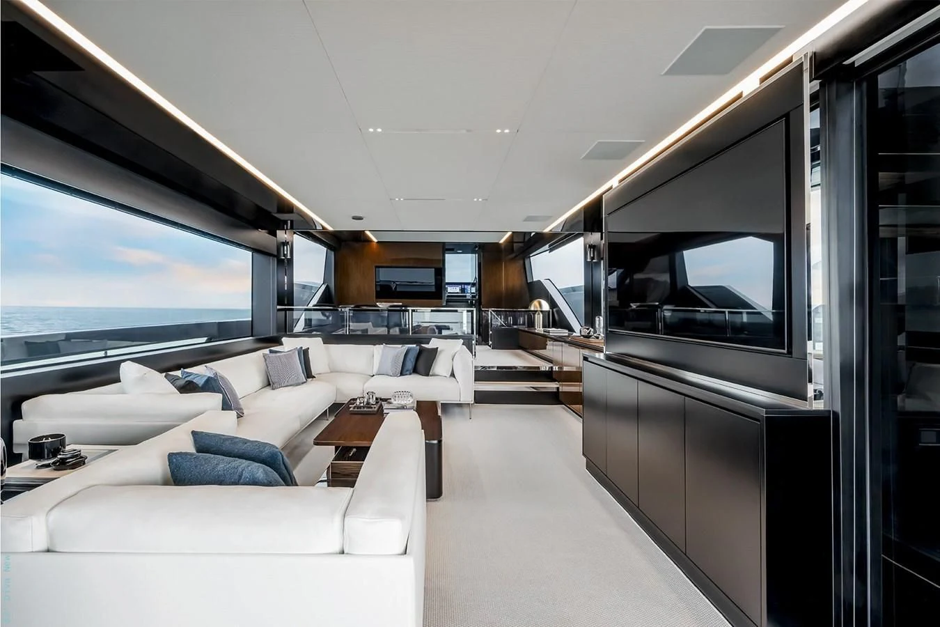 a room with a couch and a tv aboard RIVA 82 DIVA Yacht for Sale