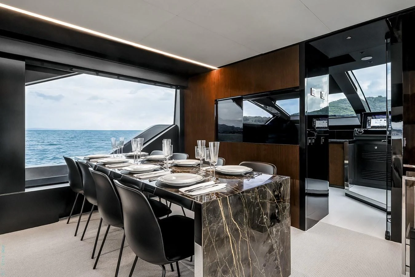 a dining table in a room aboard RIVA 82 DIVA Yacht for Sale