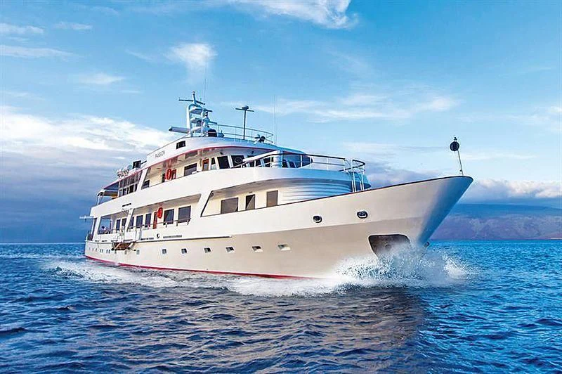 a large white boat in the water aboard PASSION Yacht for Sale