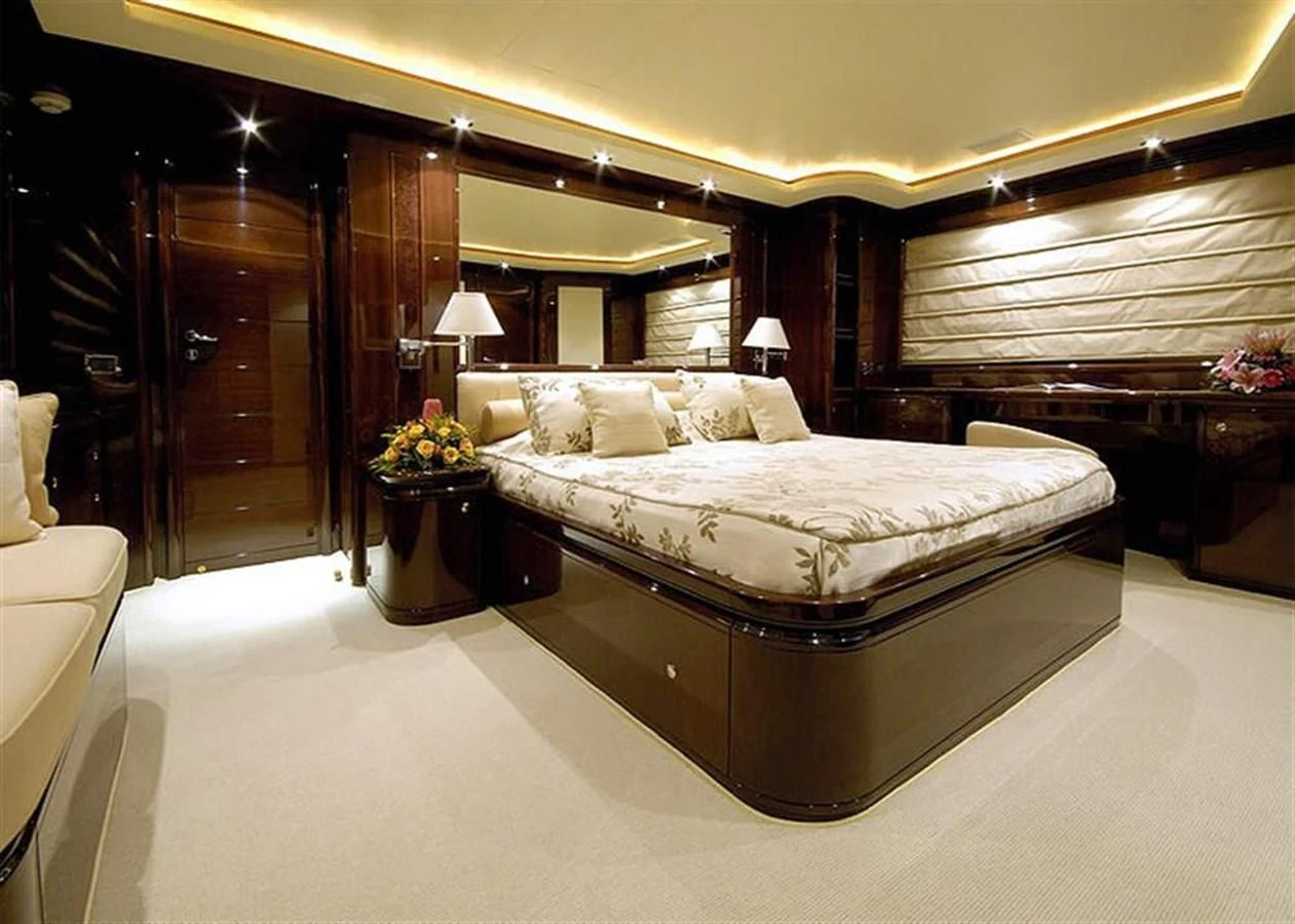 a large bedroom with a large bed aboard TWO KAY Yacht for Sale