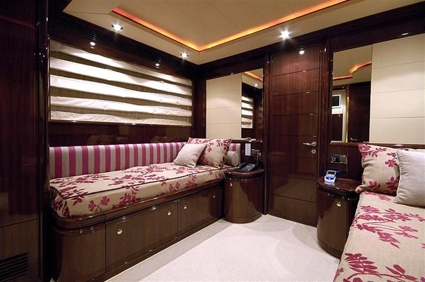 a room with a bed and a mirror aboard TWO KAY Yacht for Sale