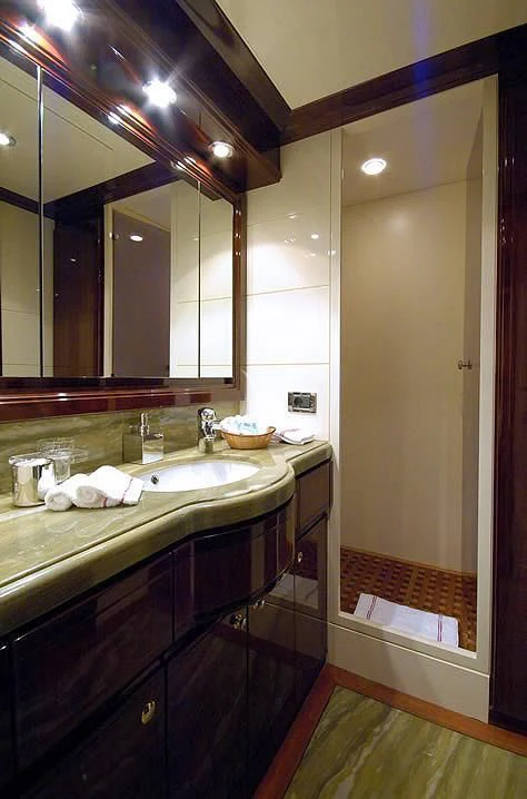 a bathroom with a large mirror aboard TWO KAY Yacht for Sale