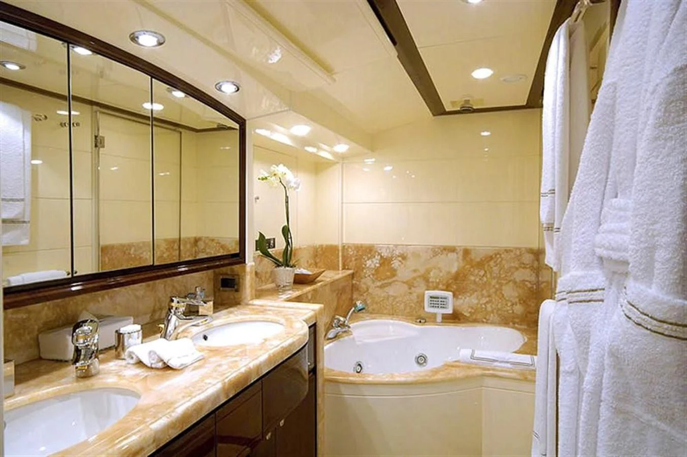a bathroom with a large mirror aboard TWO KAY Yacht for Sale