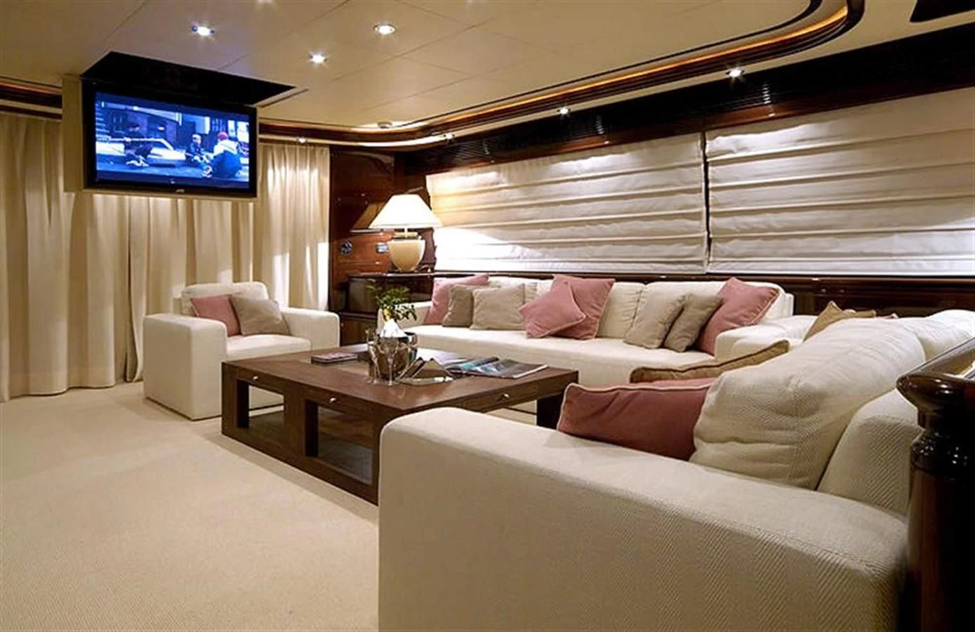a living room with a large screen aboard TWO KAY Yacht for Sale
