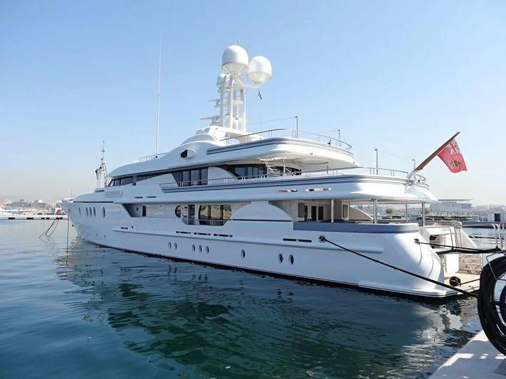 a large white boat on the water aboard LIGHTNING Yacht for Sale