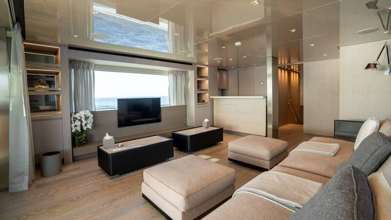 a living room with a large screen aboard LANCE Yacht for Sale