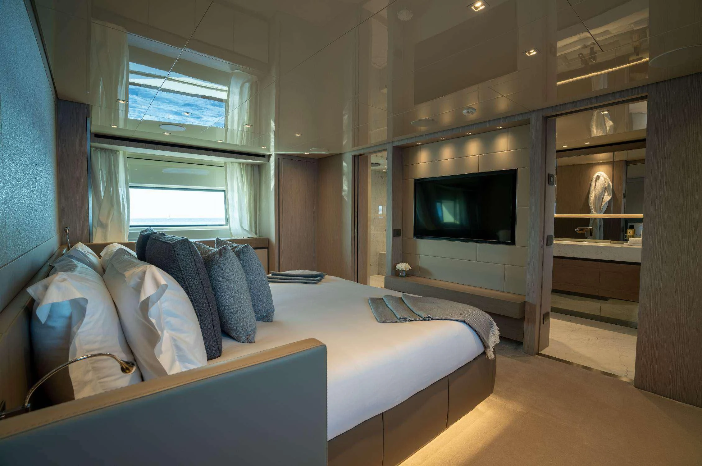 a bedroom with a bed and a television aboard LANCE Yacht for Sale