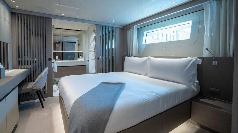 a bed in a room aboard LANCE Yacht for Sale