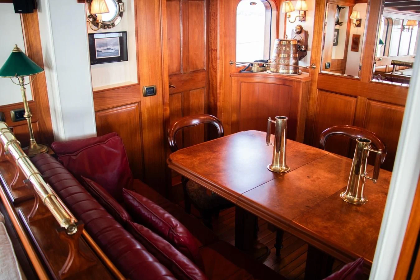 a dining table in a house aboard LADY HERTHA Yacht for Sale