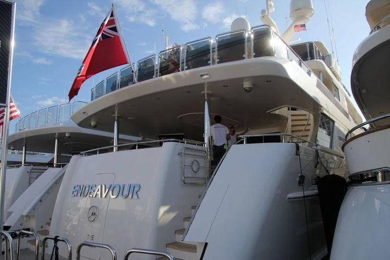 a boat with a flag on the deck aboard JESTSTREAM Yacht for Sale