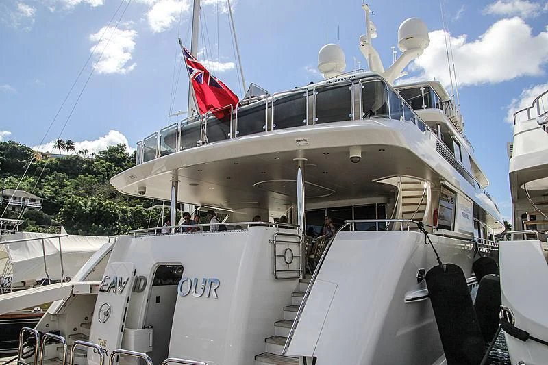a boat with a flag on the front aboard JESTSTREAM Yacht for Sale