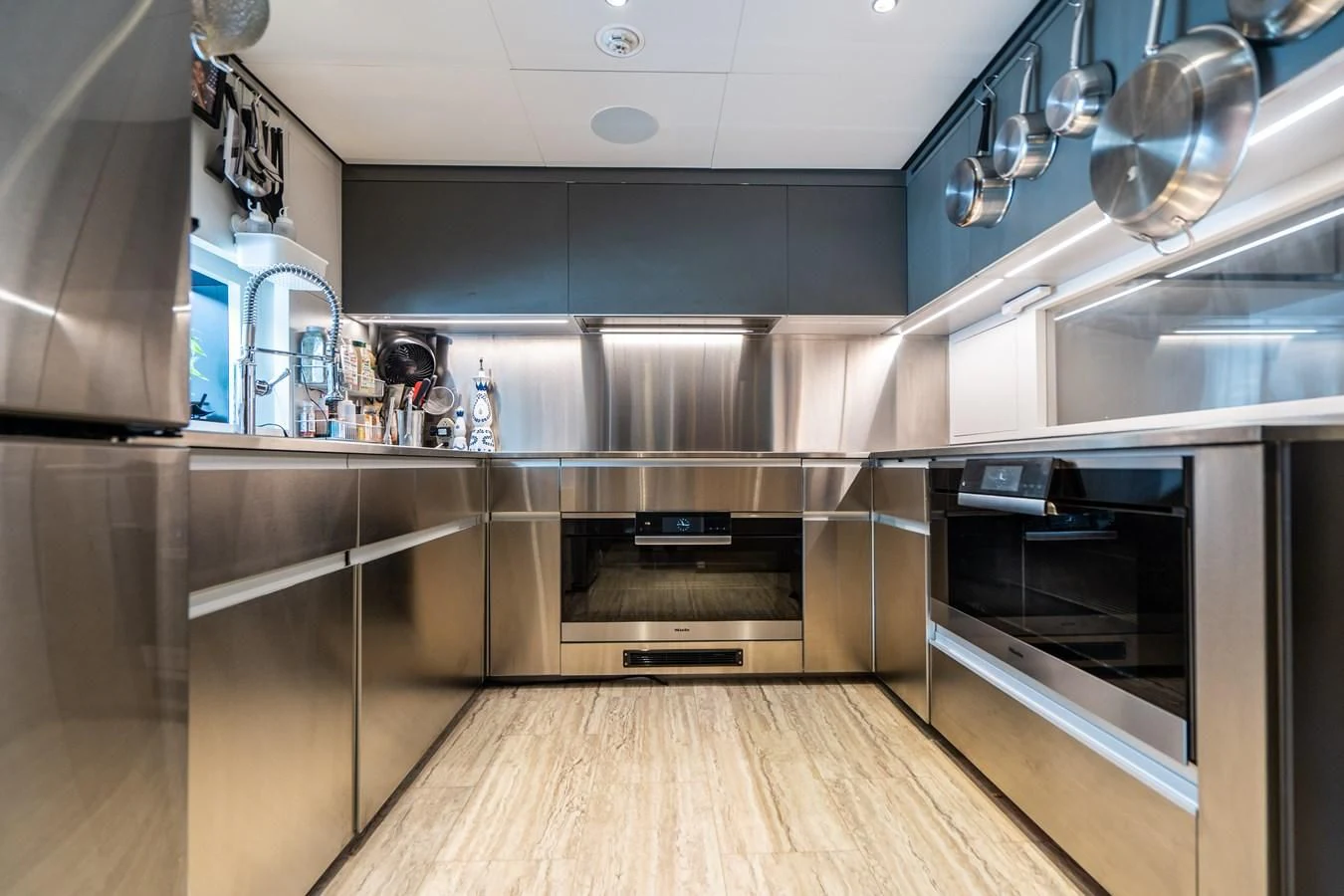 a kitchen with stainless steel appliances aboard NEVER BLUE Yacht for Sale