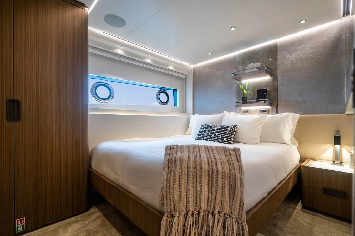 a bed with a white bed spread aboard NEVER BLUE Yacht for Sale
