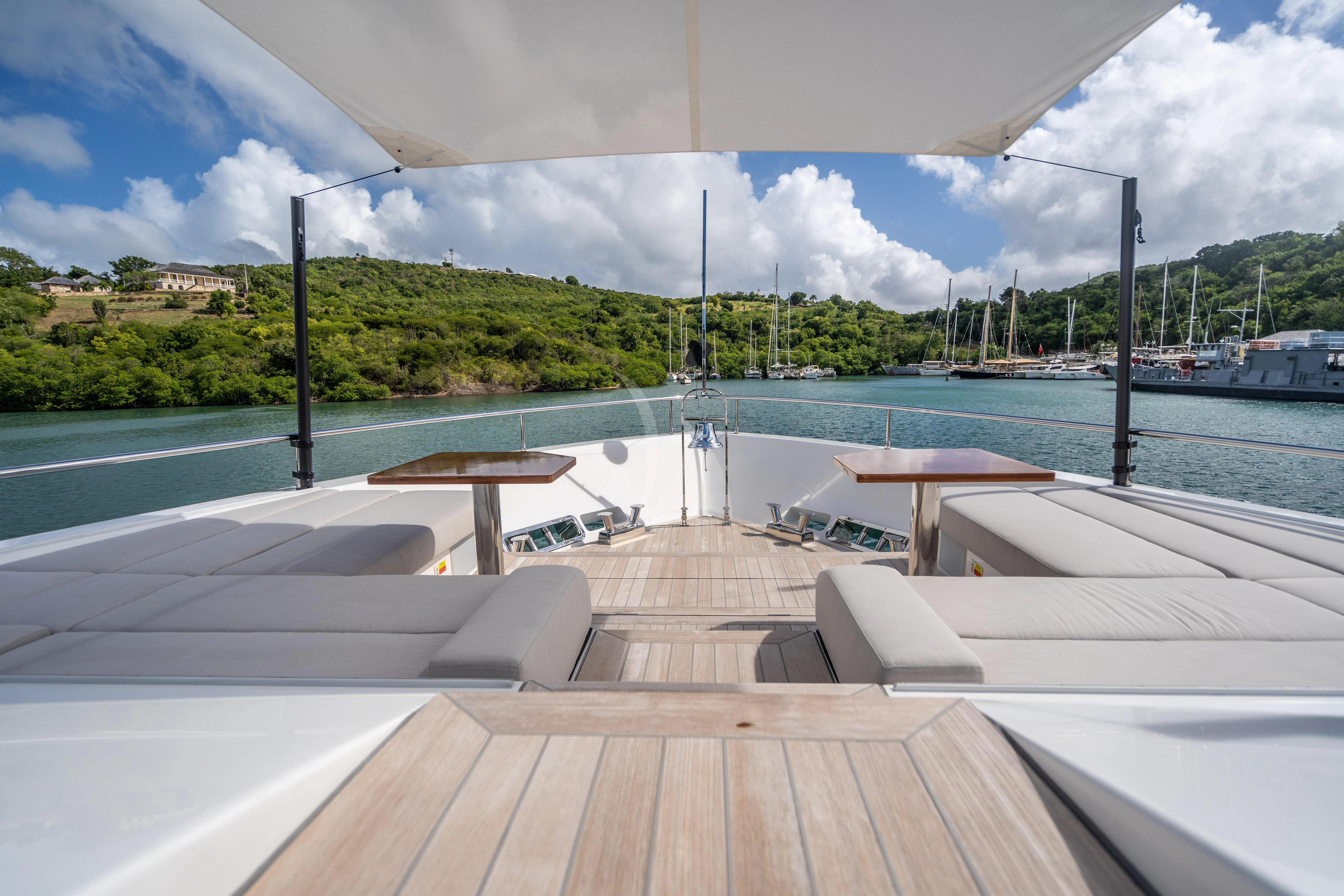 a deck with a pool and a deck with a deck and trees aboard NEVER BLUE Yacht for Sale