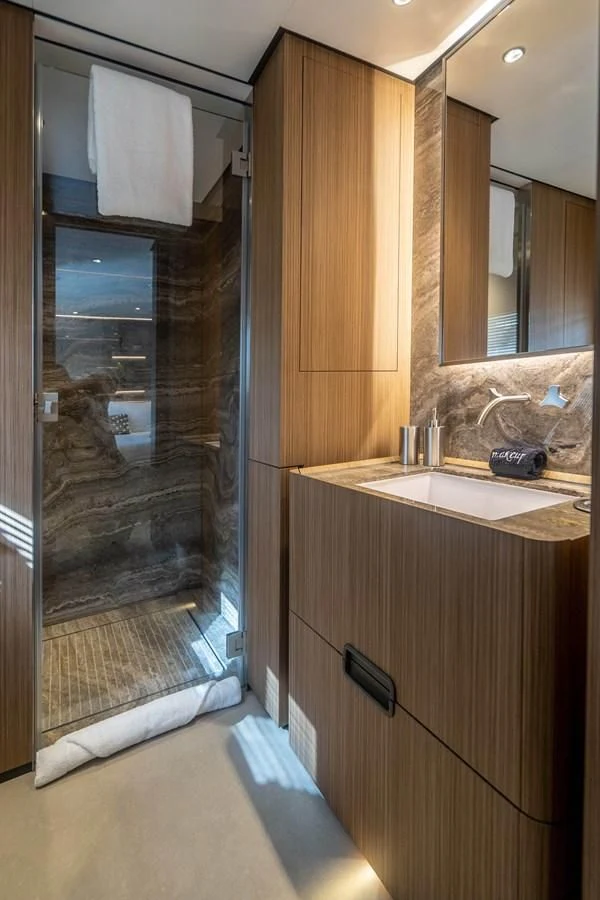 a bathroom with a glass shower aboard NEVER BLUE Yacht for Sale