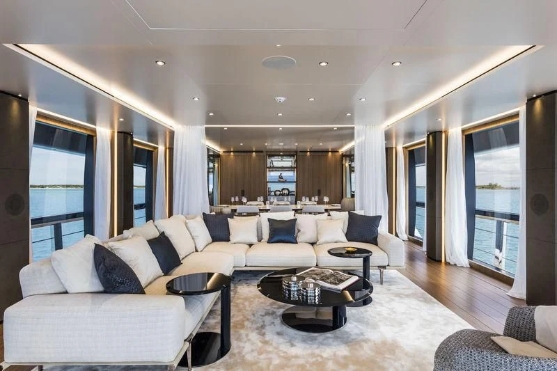 a living room with a couch and a coffee table aboard NEVER BLUE Yacht for Sale