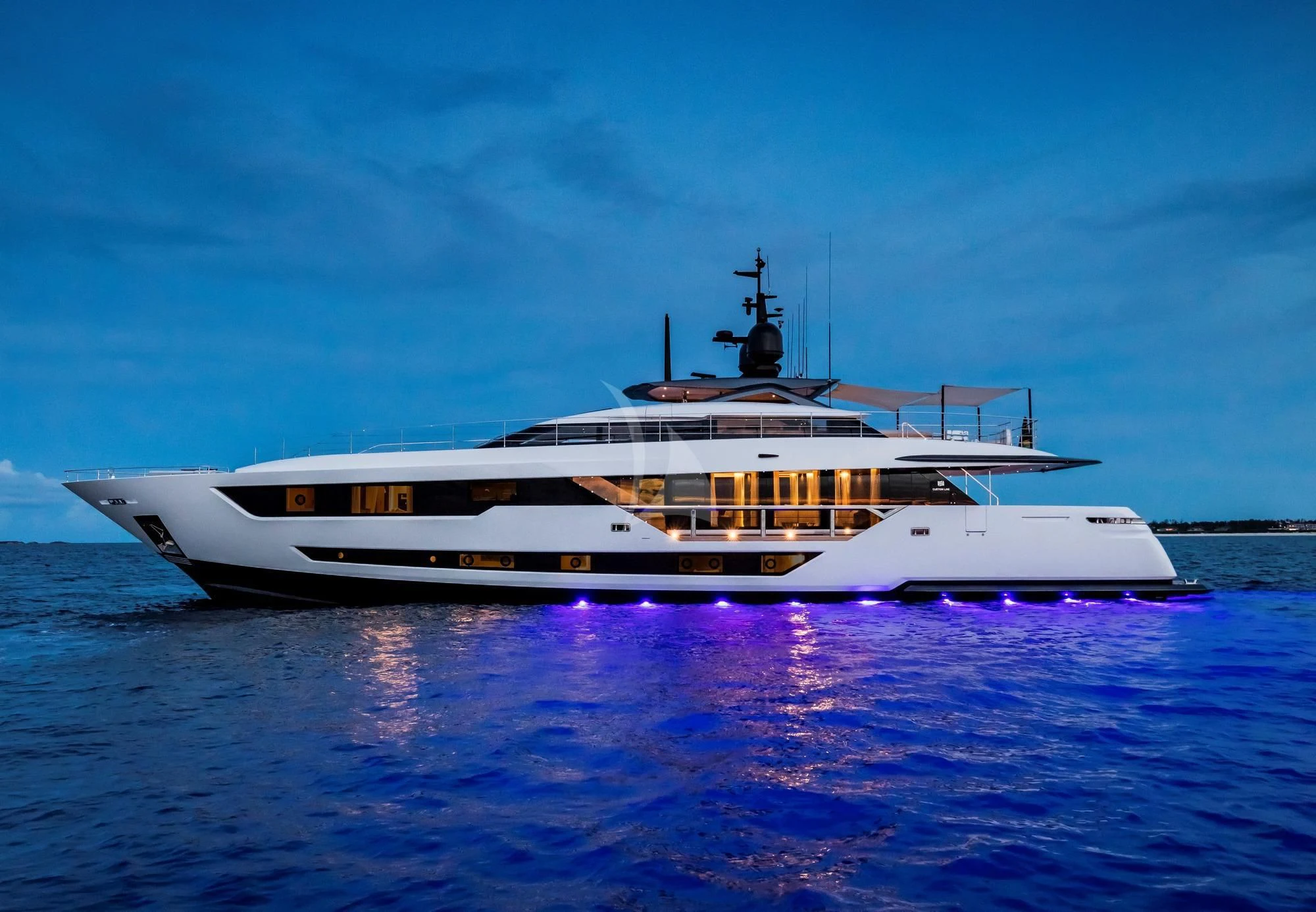 a white yacht on the water aboard NEVER BLUE Yacht for Sale