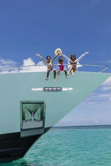 a group of people jumping into the water aboard NEVER BLUE Yacht for Sale