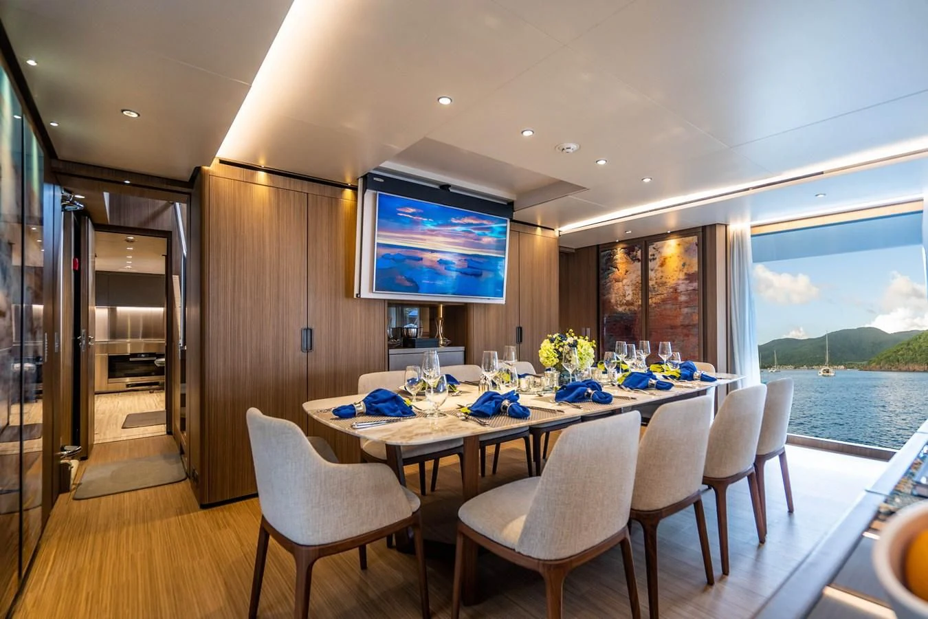 a room with a table and chairs aboard NEVER BLUE Yacht for Sale