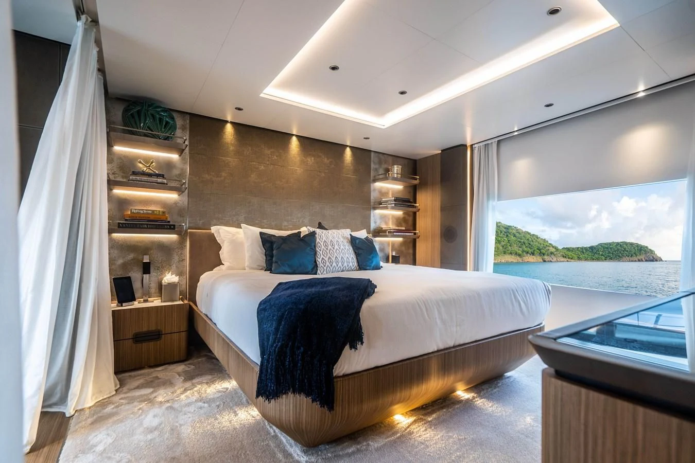 a bedroom with a large window aboard NEVER BLUE Yacht for Sale