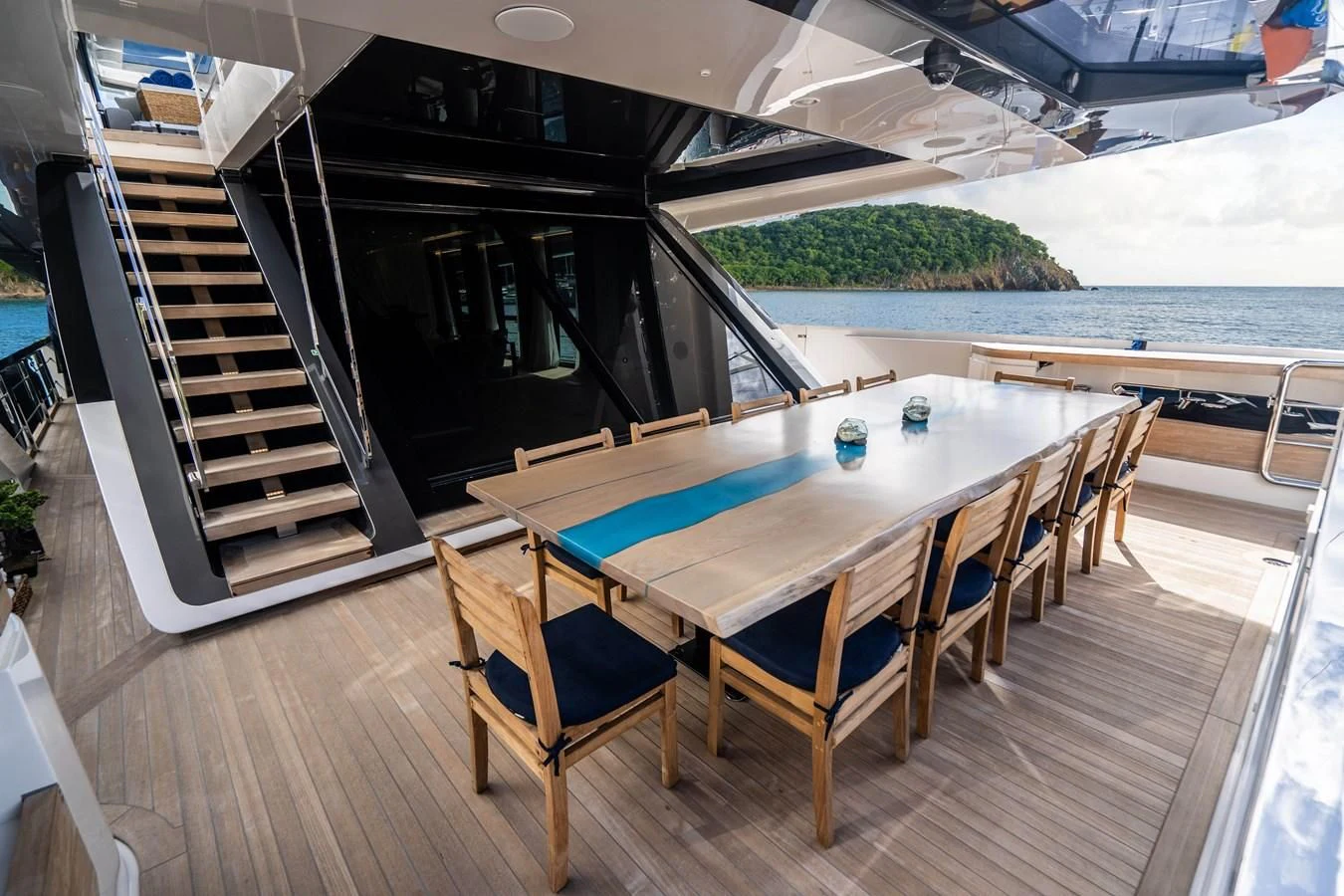 a table and chairs on a deck aboard NEVER BLUE Yacht for Sale