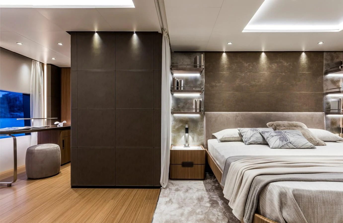 a bedroom with a bed and a desk aboard NEVER BLUE Yacht for Sale