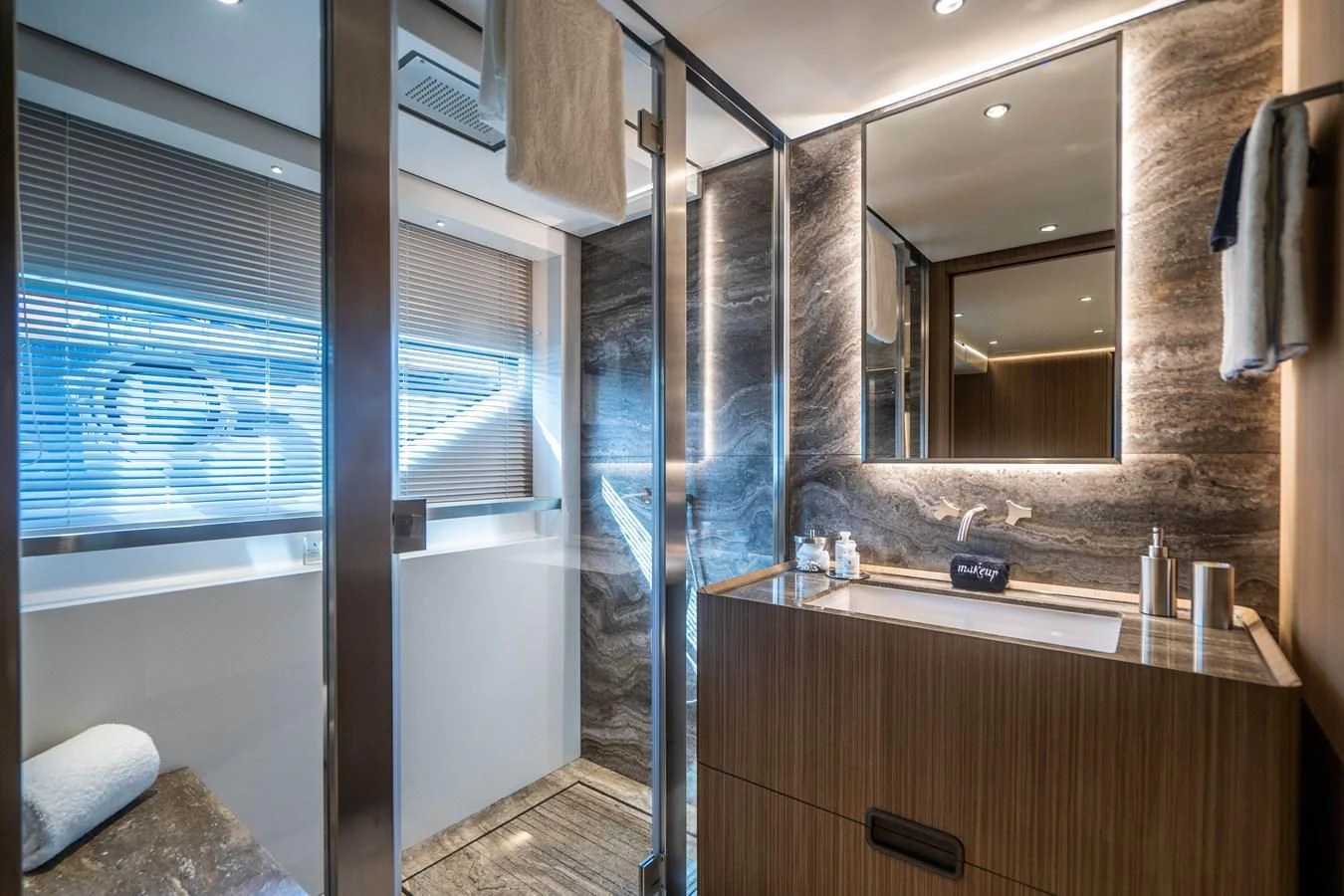 a bathroom with a large mirror aboard NEVER BLUE Yacht for Sale