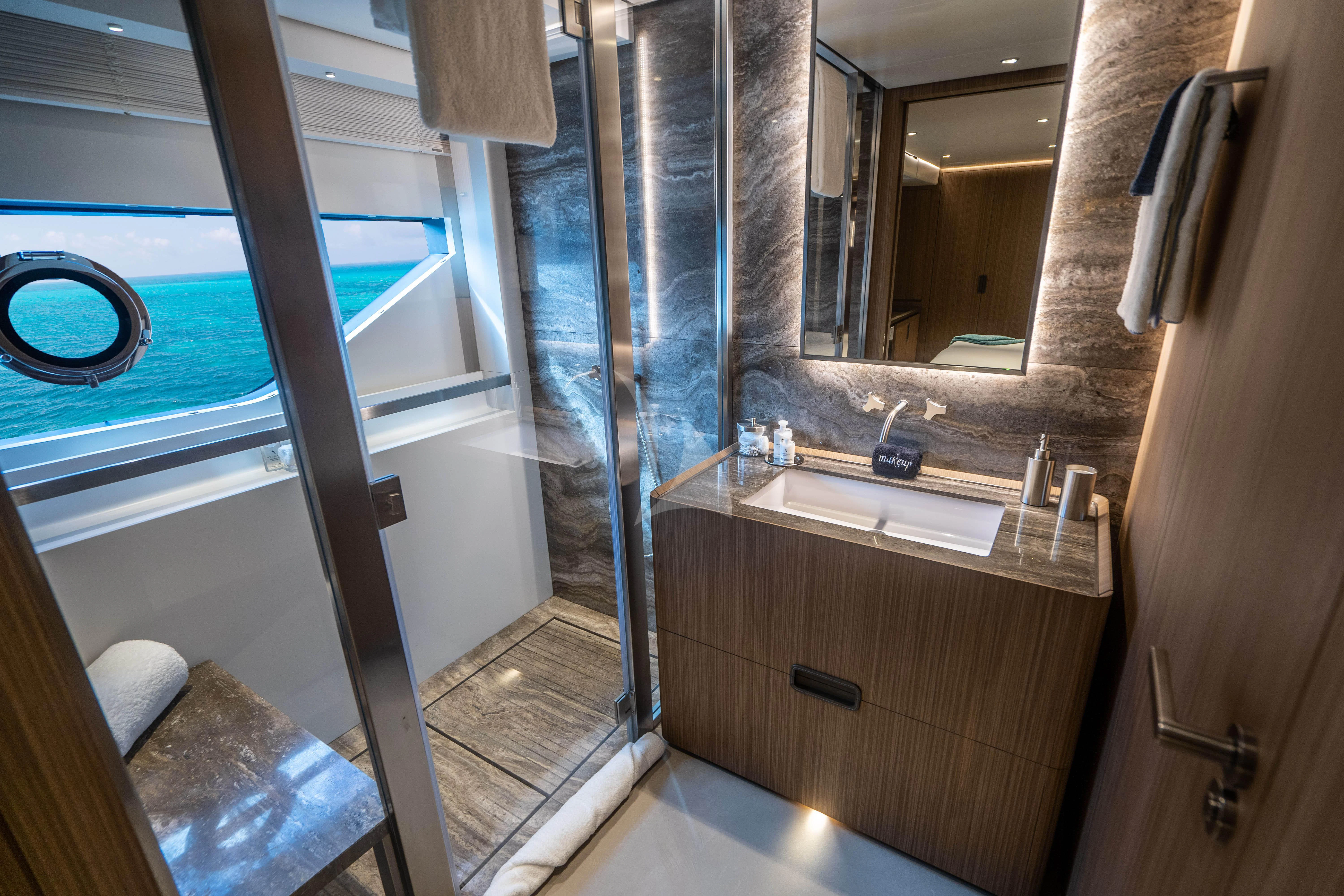 a bathroom with a glass shower aboard NEVER BLUE Yacht for Sale