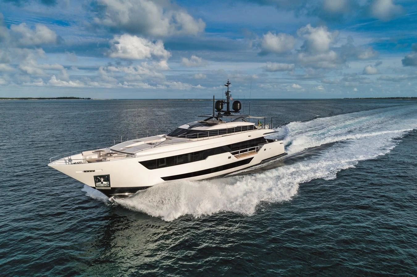 a white boat on water aboard NEVER BLUE Yacht for Sale