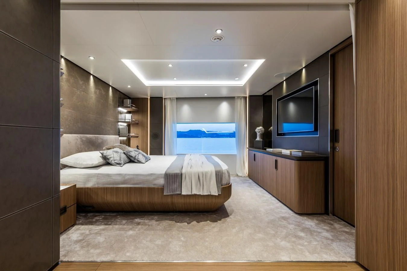 a bedroom with a bed and a tv aboard NEVER BLUE Yacht for Sale