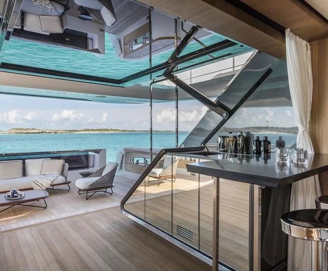 a room with a view of the ocean and the deck aboard NEVER BLUE Yacht for Sale