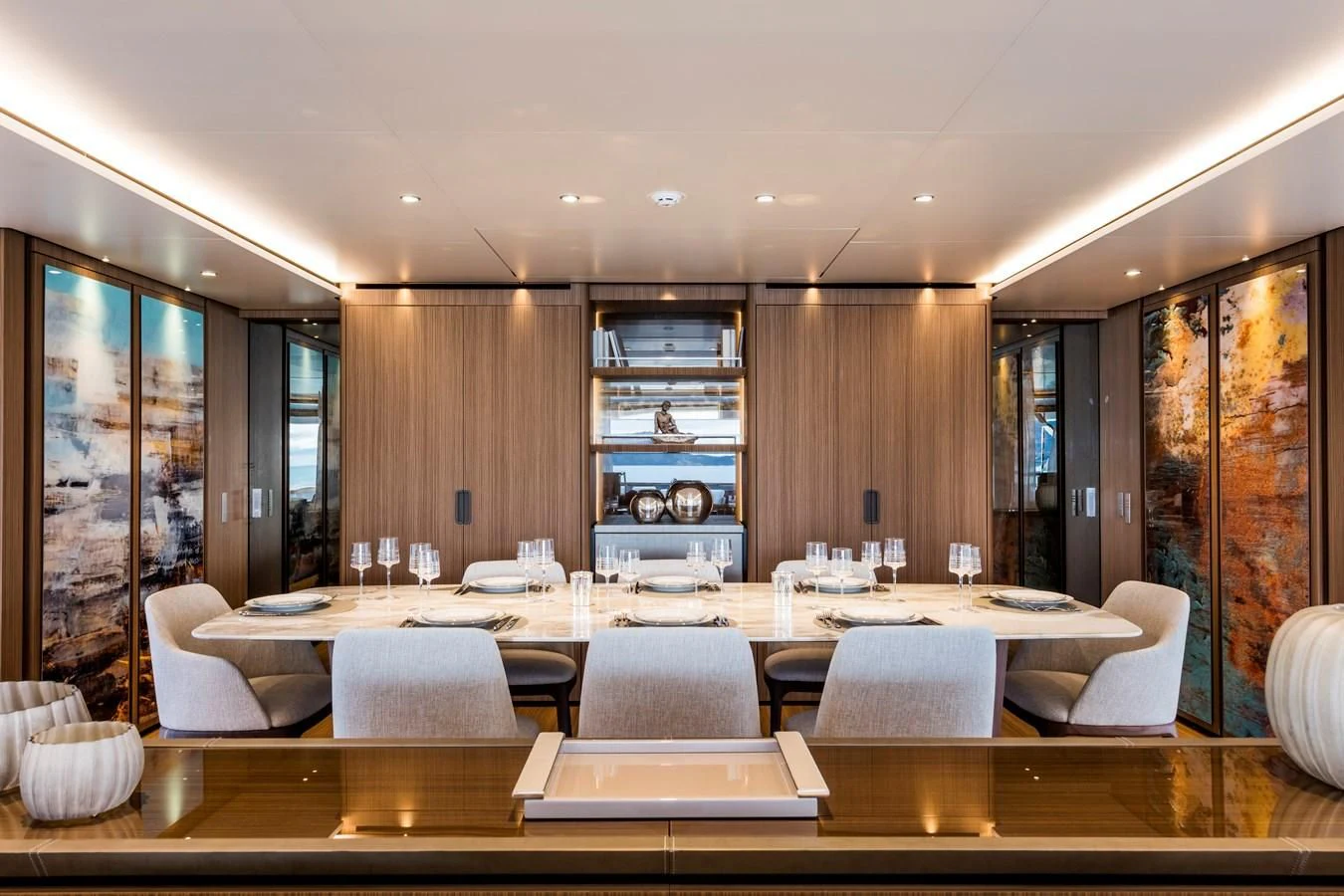 a large room with a table and chairs aboard NEVER BLUE Yacht for Sale