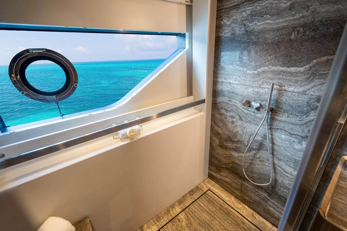 a door with a round mirror on the side aboard NEVER BLUE Yacht for Sale