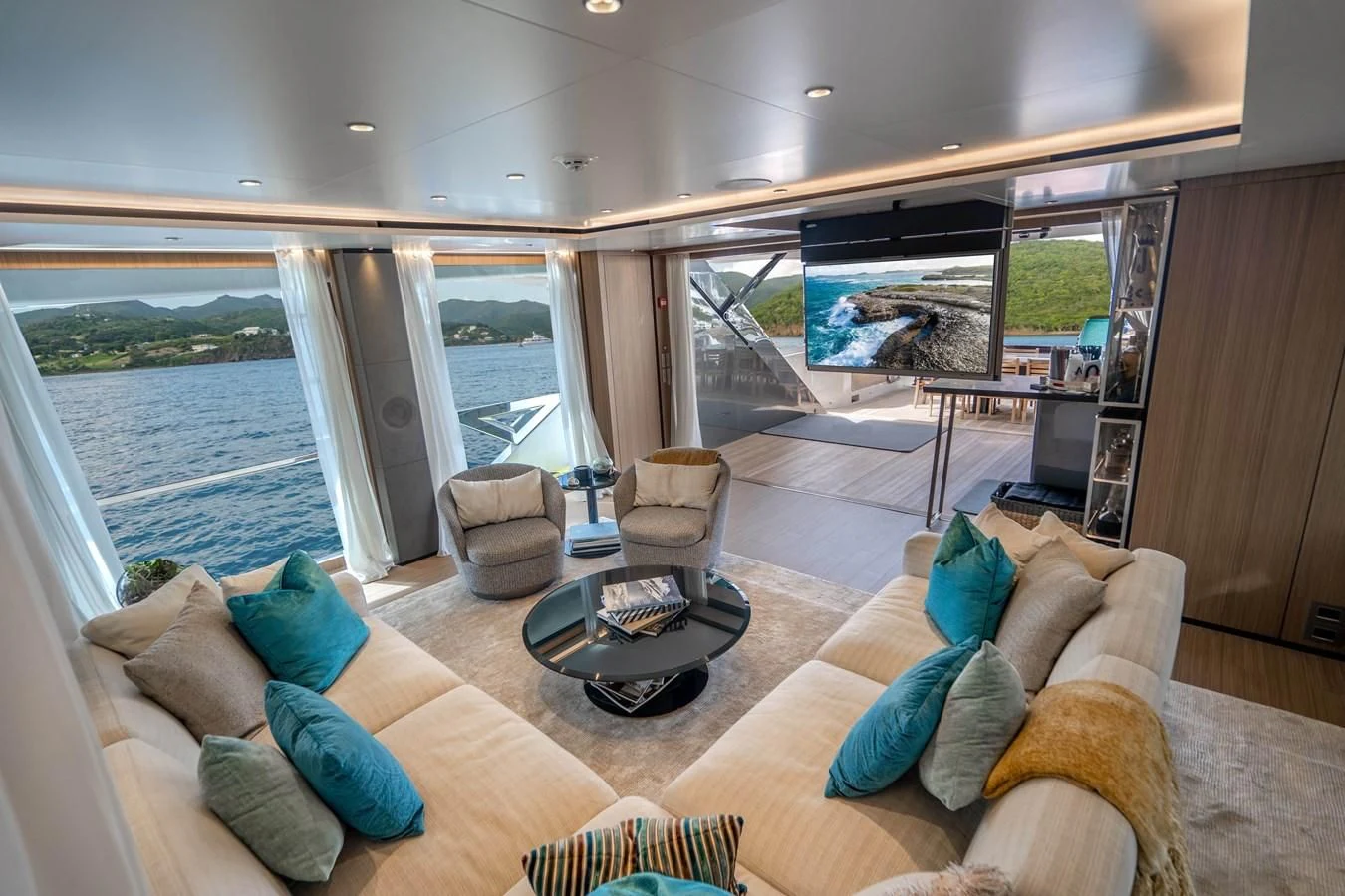 a living room with a large window aboard NEVER BLUE Yacht for Sale