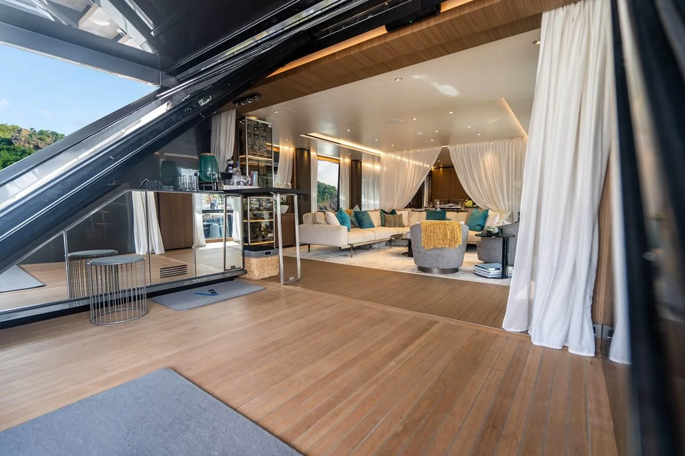 a room with a wood floor and a large window aboard NEVER BLUE Yacht for Sale