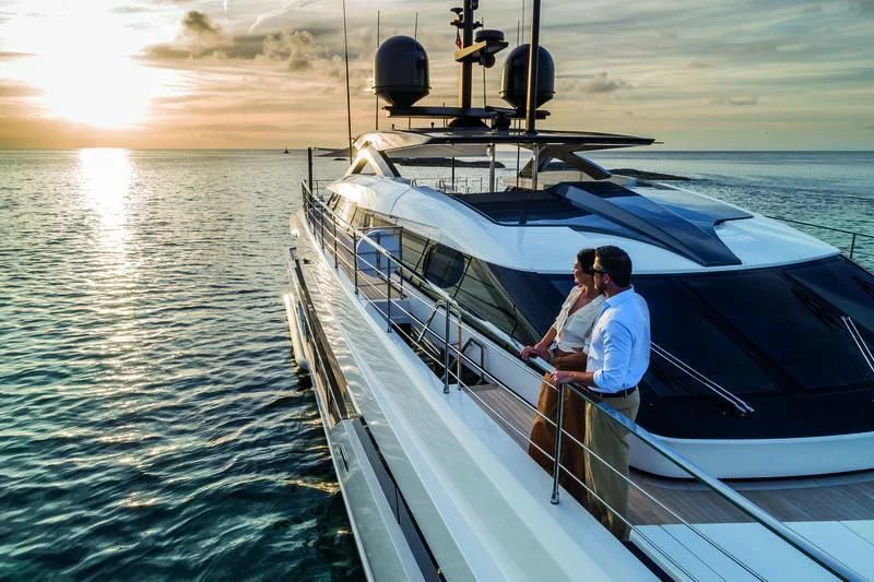 a man sitting on a boat aboard NEVER BLUE Yacht for Sale
