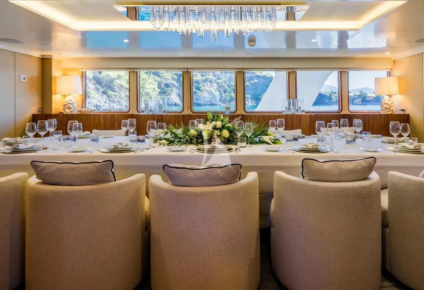 a room with a table and chairs aboard ITOTO Yacht for Charter