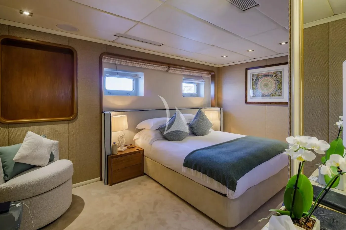 a bedroom with a bed and a couch aboard ITOTO Yacht for Charter