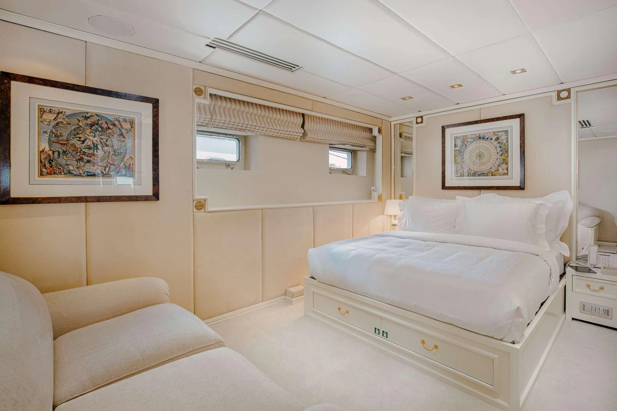 a bedroom with a bed and a couch aboard ITOTO Yacht for Charter