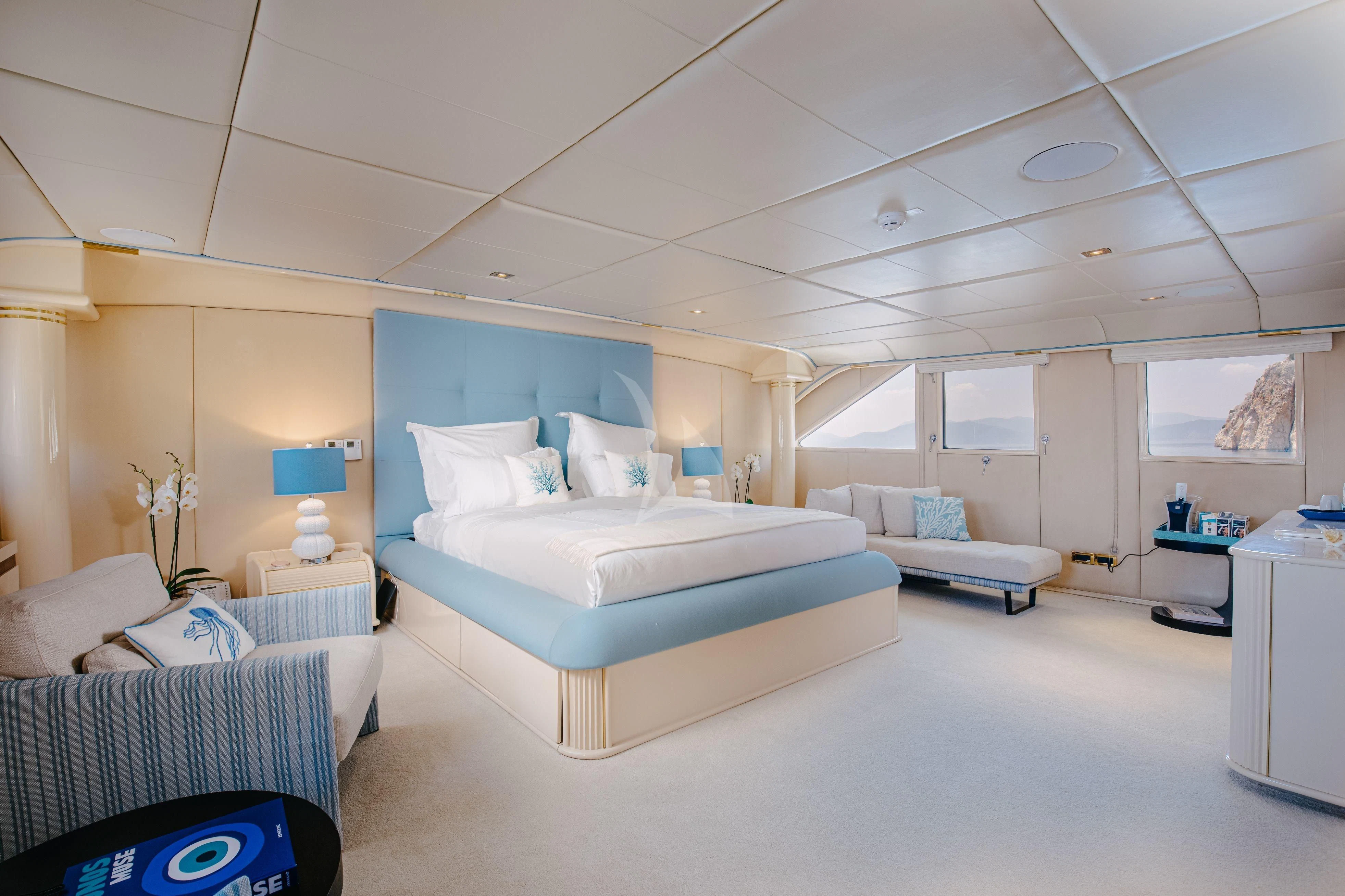 a room with a bed and a desk aboard ITOTO Yacht for Charter