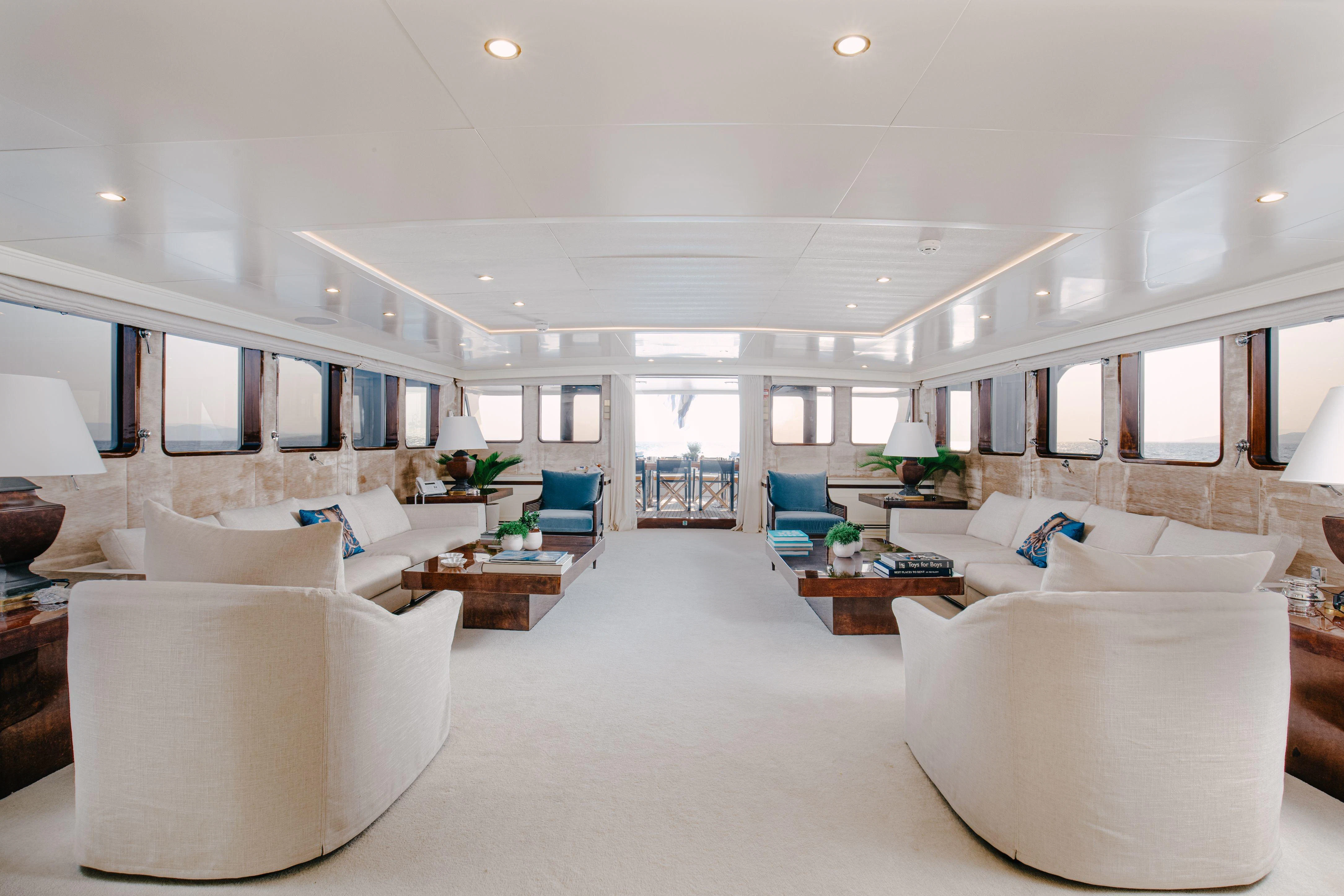 a large white living room aboard ITOTO Yacht for Charter