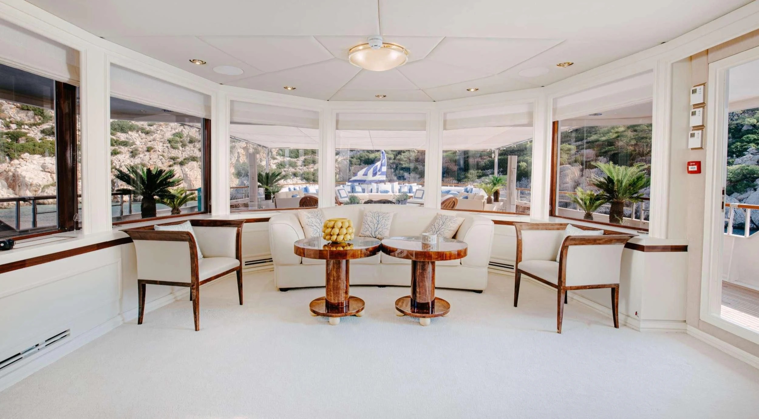 a room with a table and chairs aboard ITOTO Yacht for Charter