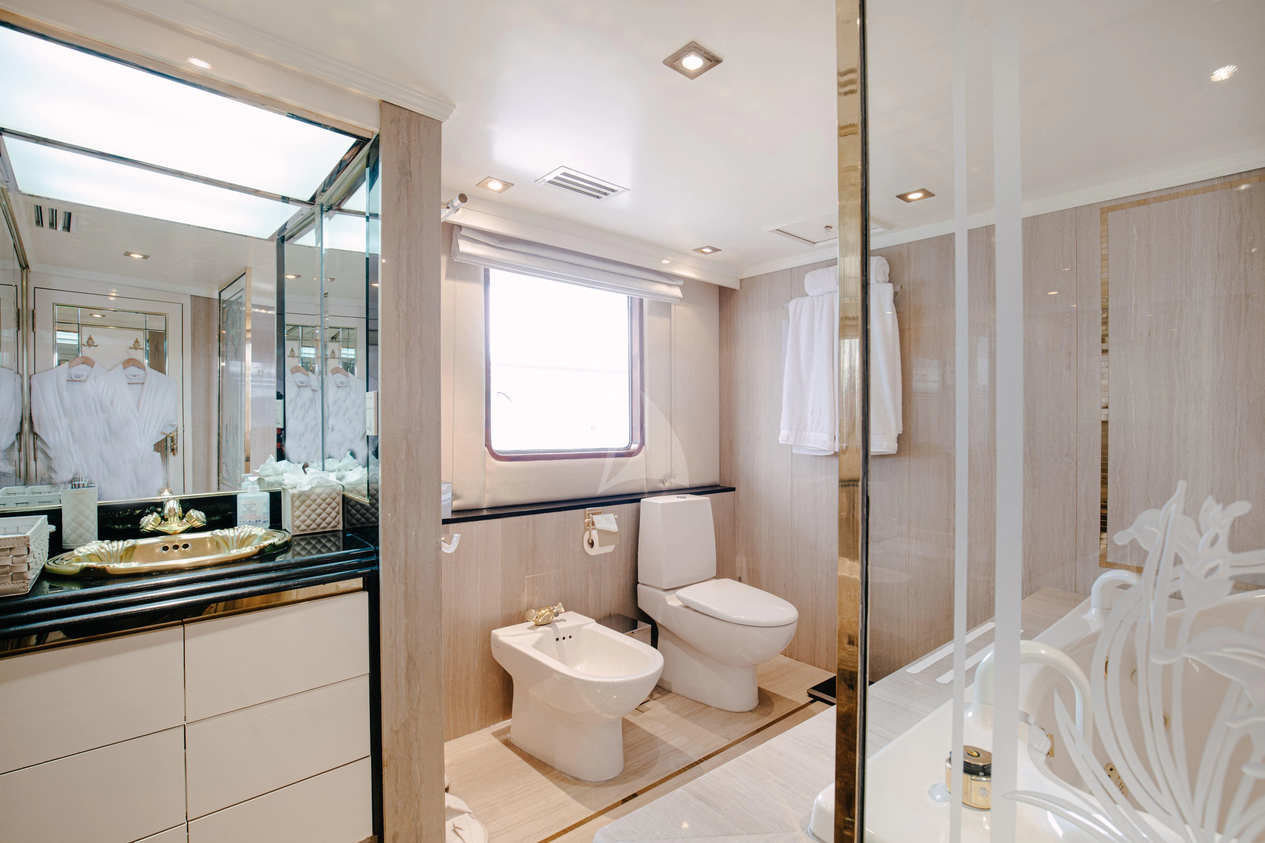 a bathroom with a glass shower aboard ITOTO Yacht for Charter