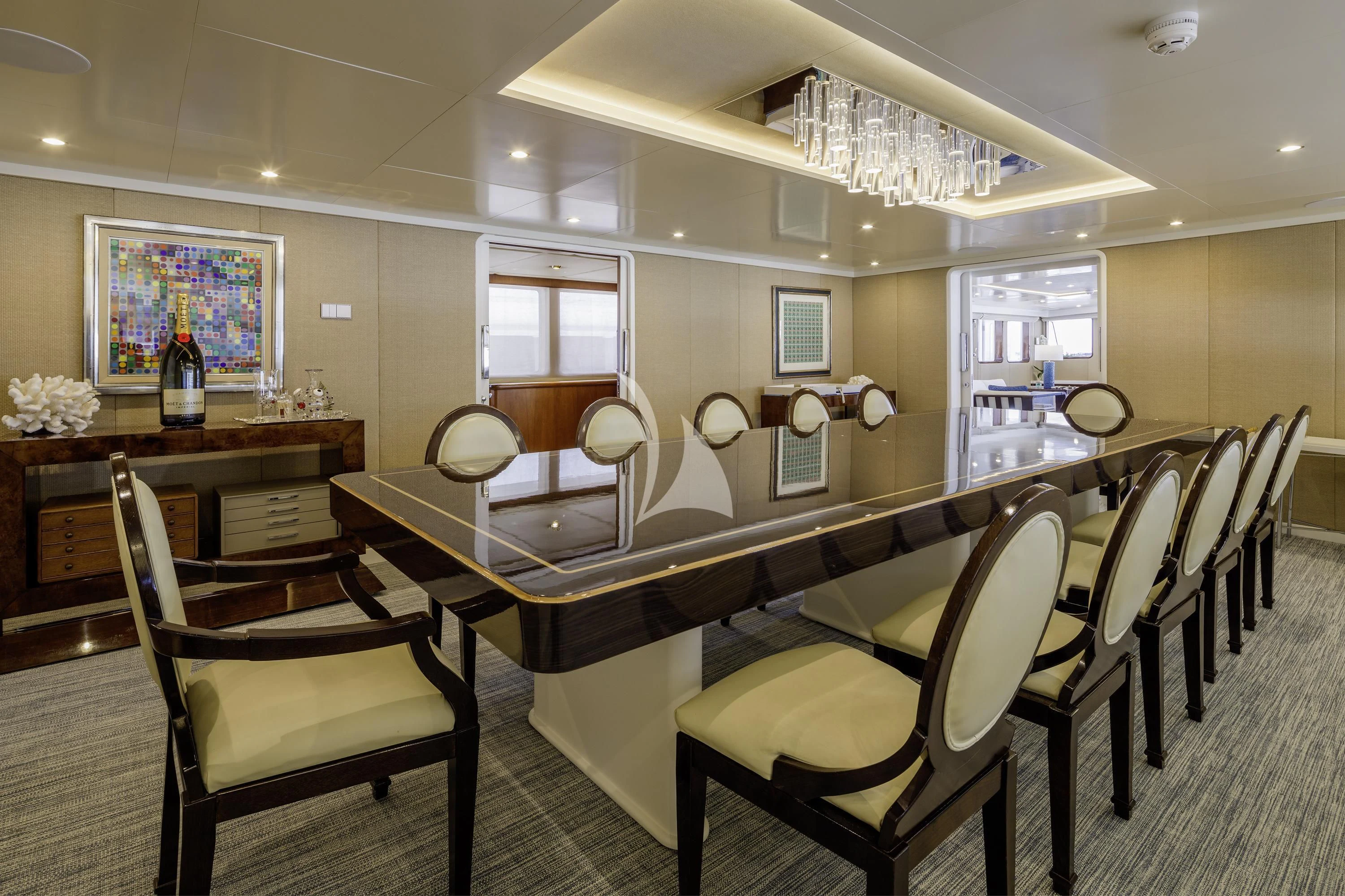 a dining room with chairs and tables aboard ITOTO Yacht for Charter