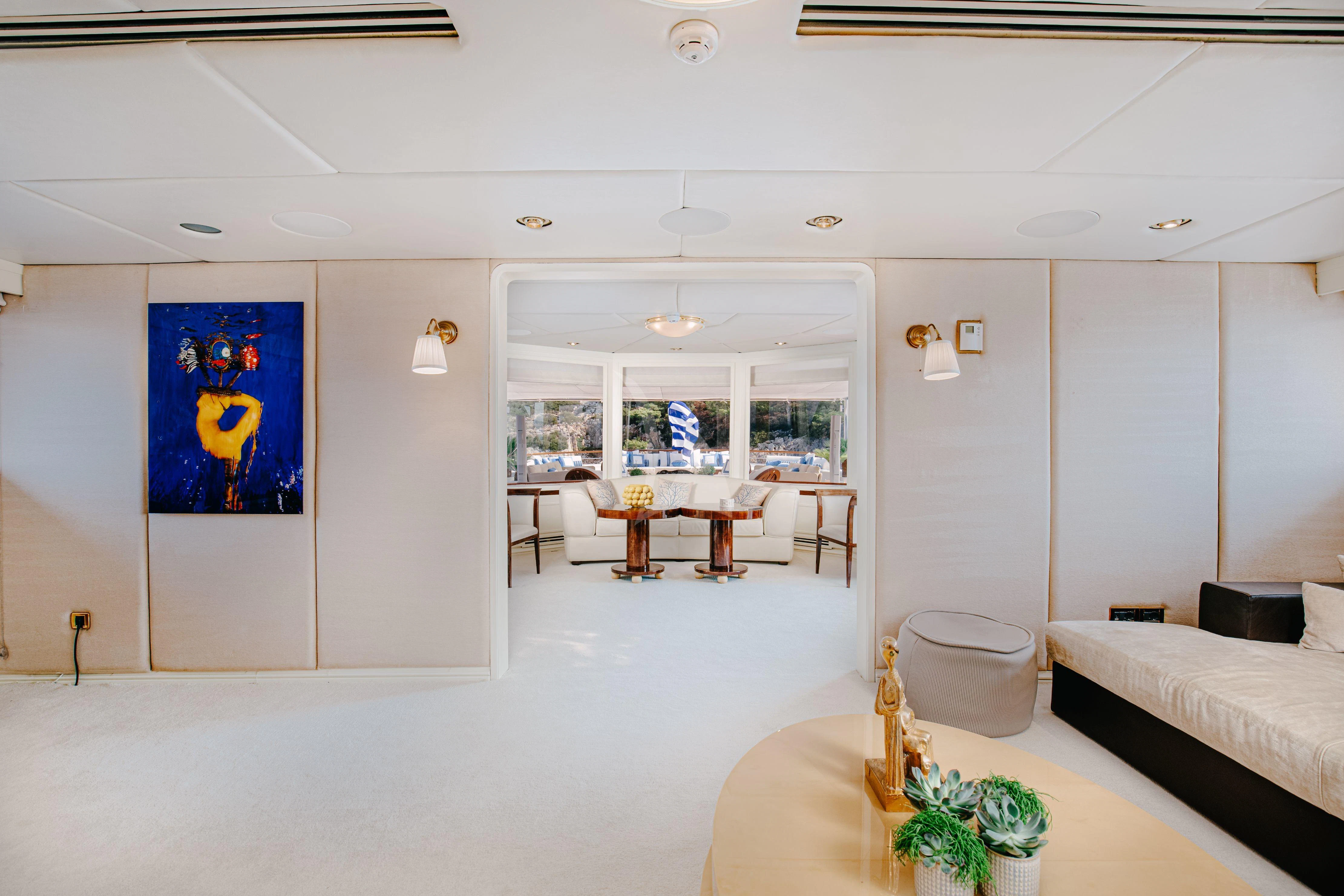 a living room with a couch and a table aboard ITOTO Yacht for Charter
