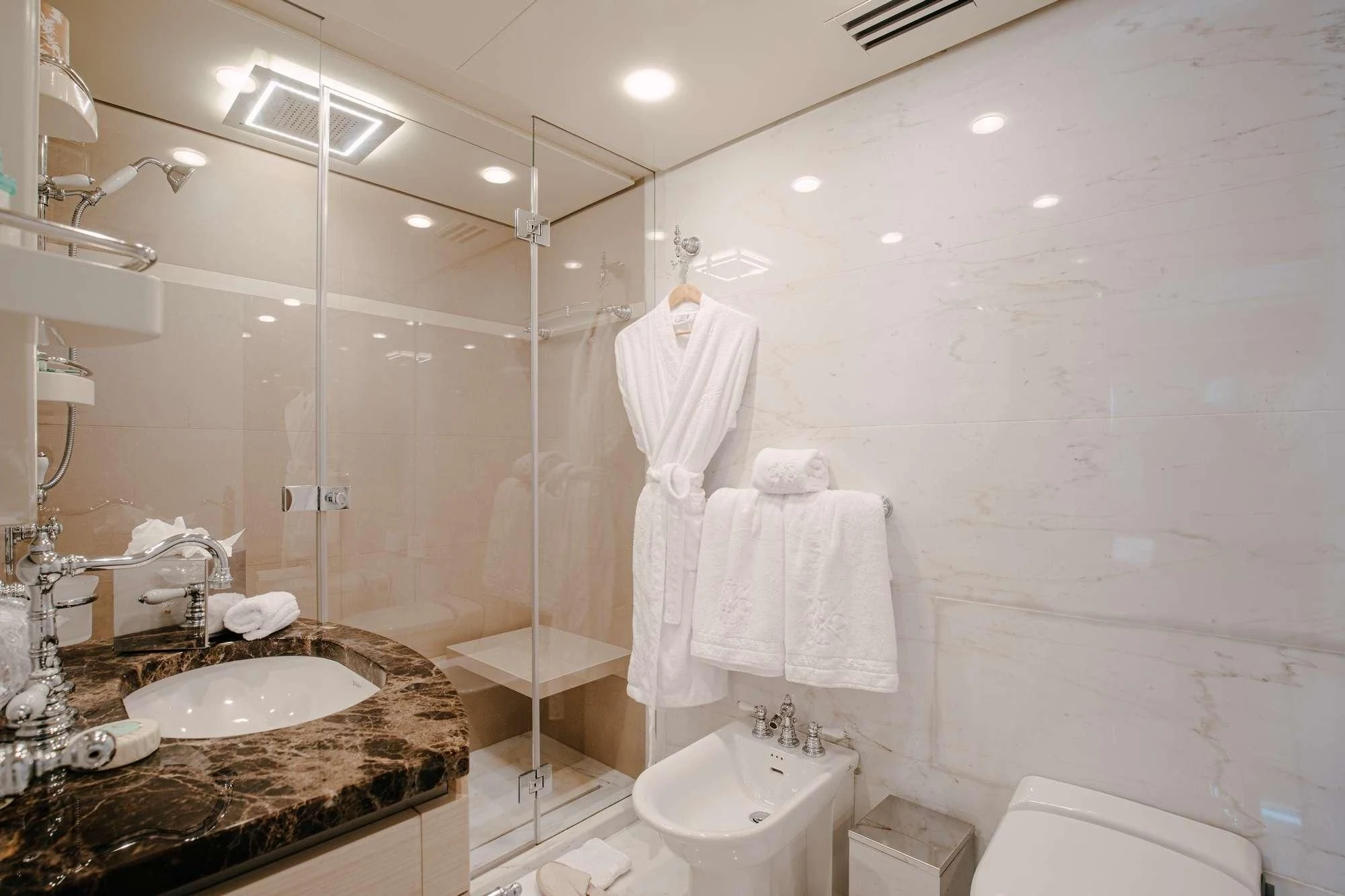 a bathroom with a sink and a bathtub aboard ITOTO Yacht for Charter