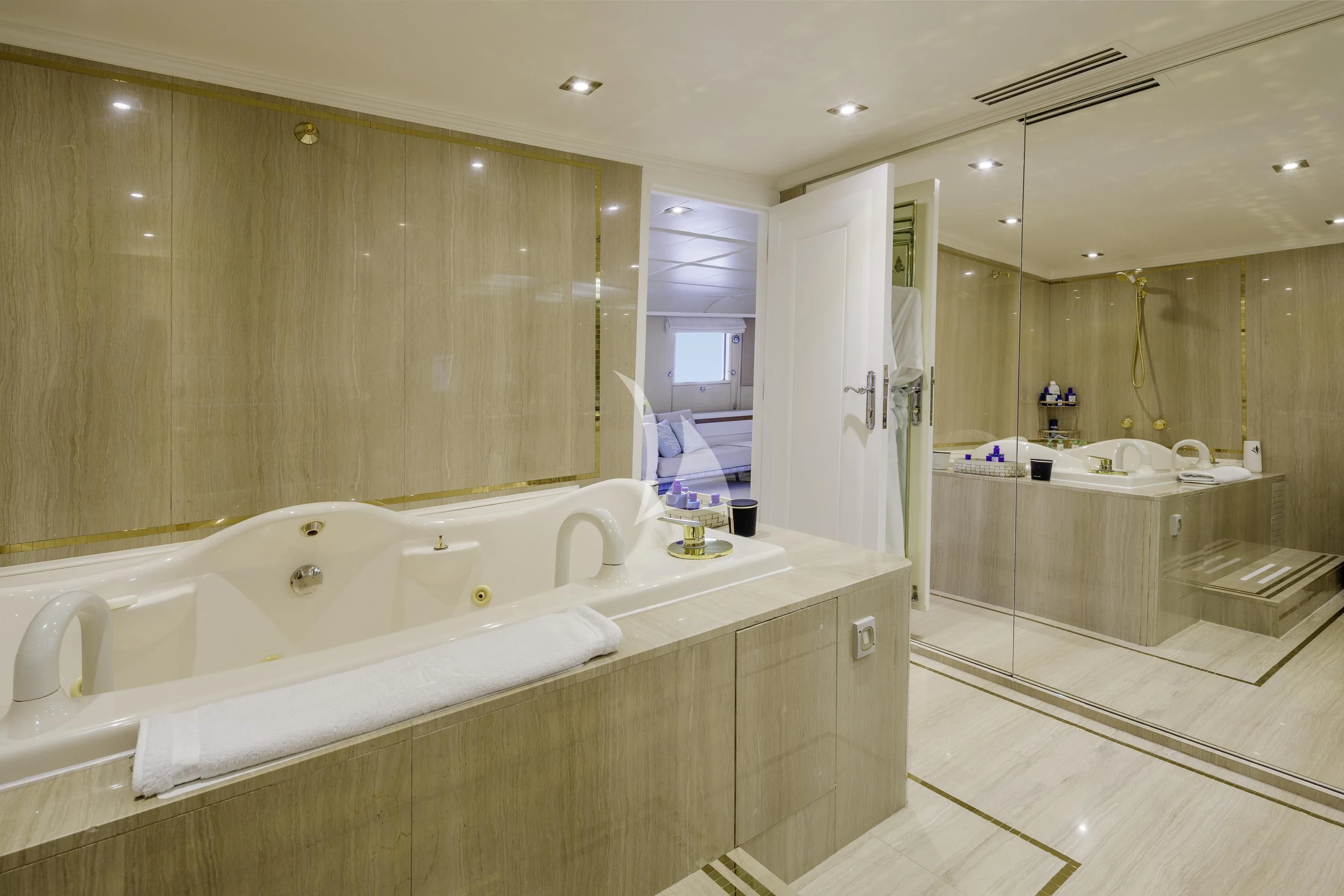 a bathroom with a large bathtub aboard ITOTO Yacht for Charter
