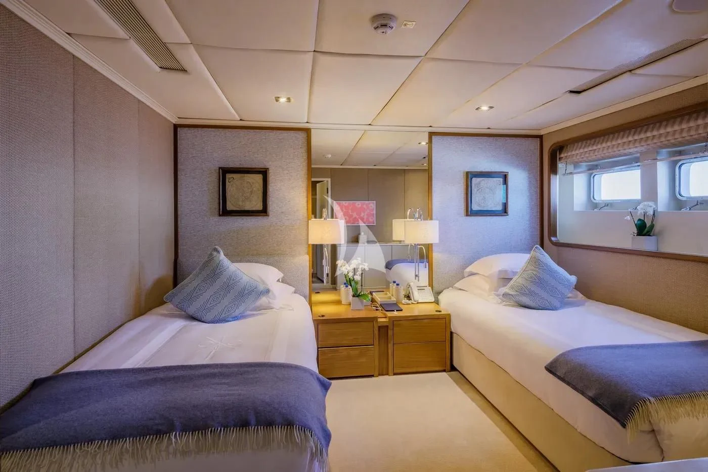 a room with two beds aboard ITOTO Yacht for Charter